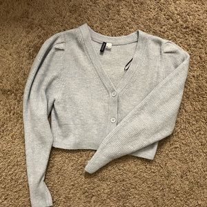 Small light blue cropped sweater with buttons from H&M